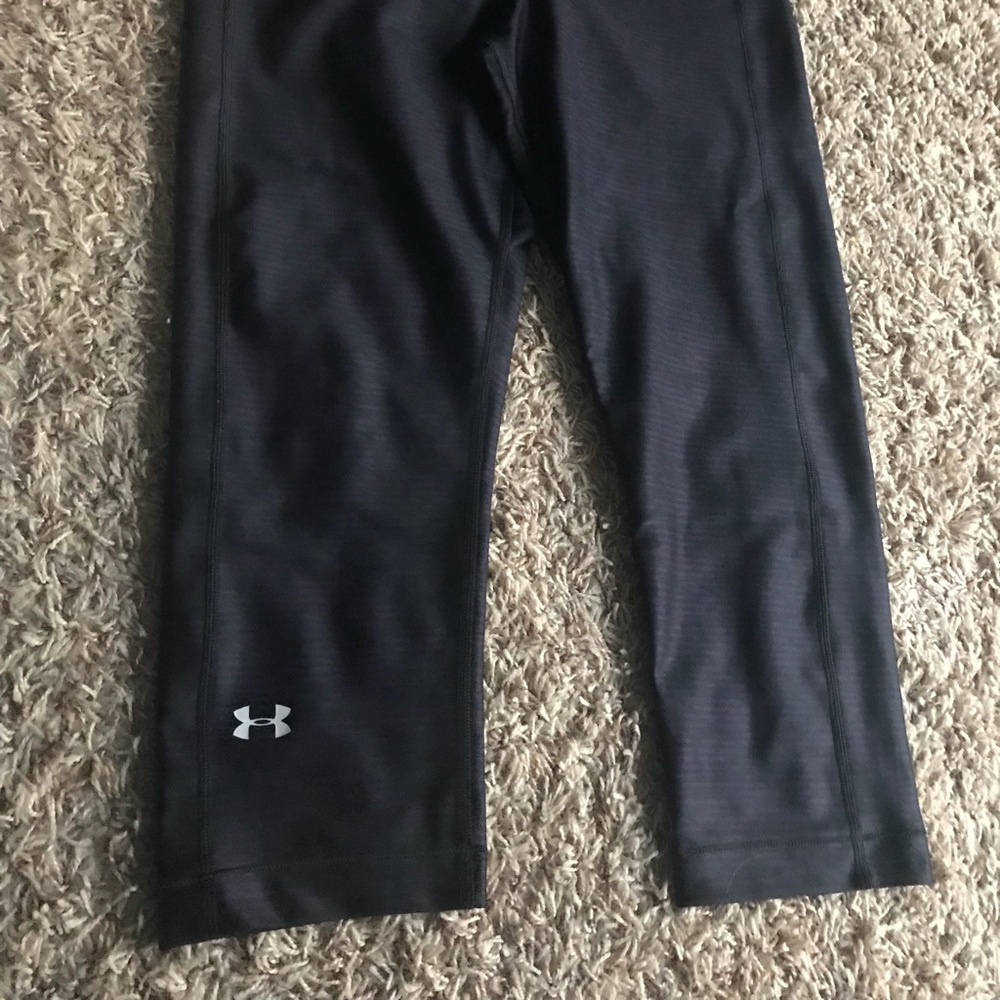 Purple and black UnderArmour Capri pants